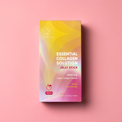 Žele palčka z vegankimi peptidi z okusom breskve brez glutena na roza podlagi