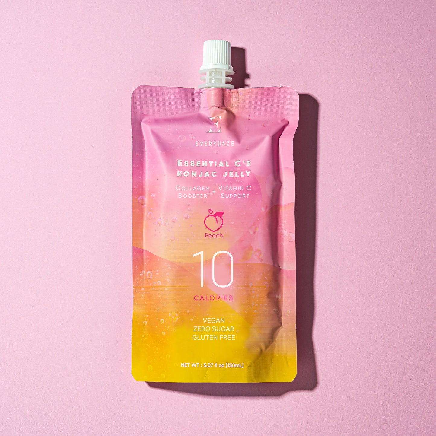 Osvežilni veganski konjak jelly z okusom breskve, obogaten s kolagenom in vitaminom C na roza podlagi